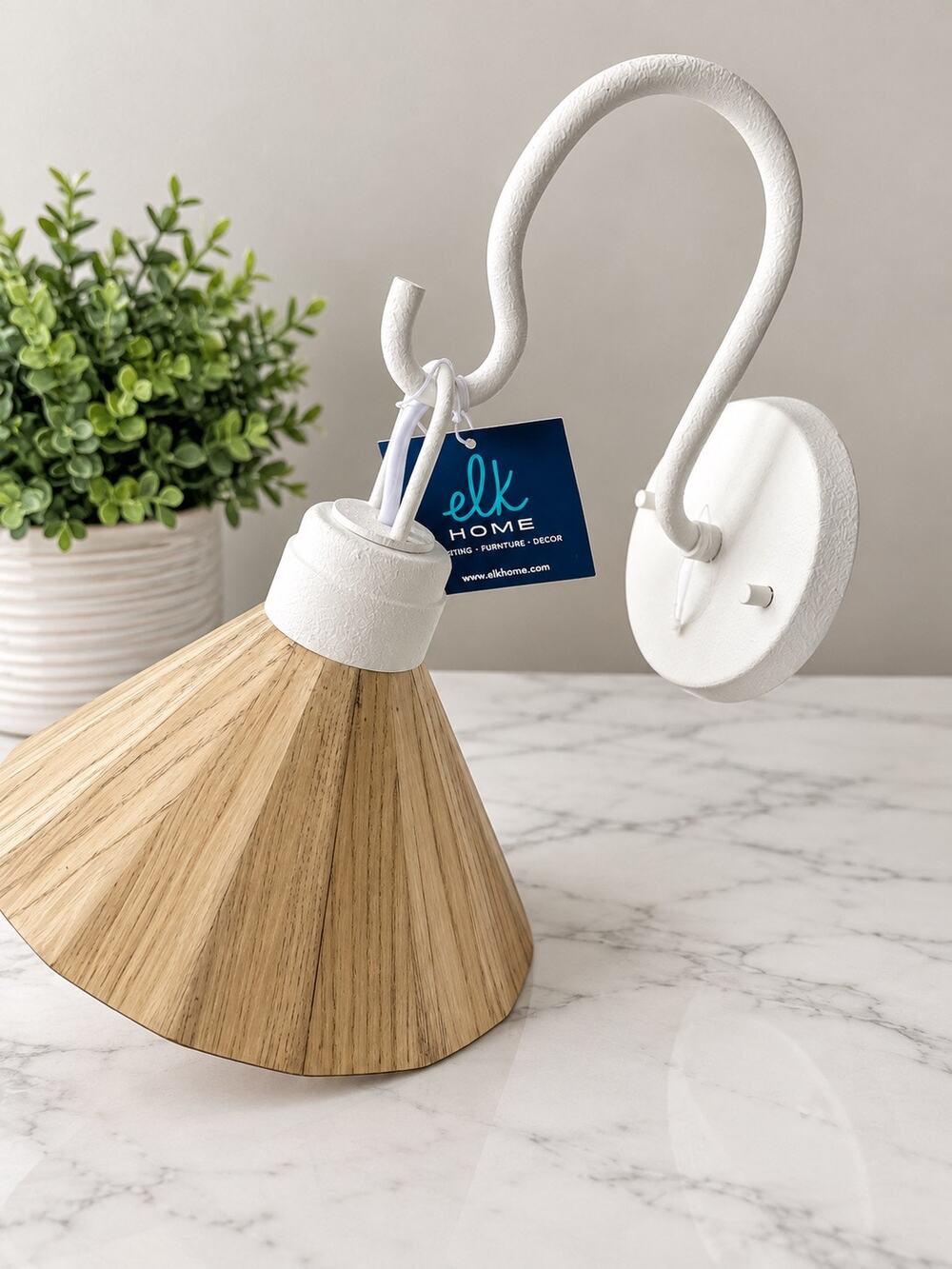 contemporary wall sconce from the brand Elk Home It showcases a beautiful fusion